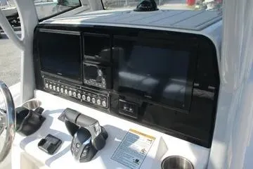 Slide: The Image of Dashboard of 2026 Sea Fox 282 Hybrid LT boat with modern controls and displays. - 11