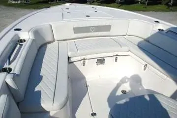 Slide: The Image of 2026 Sea Fox 282 Hybrid LT boat interior with white cushioned seating. - 16