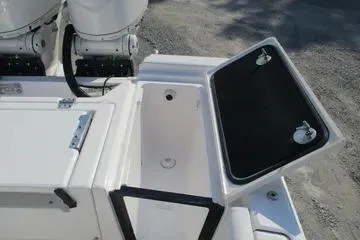 Slide: The Image of 2026 Sea Fox 282 Hybrid LT boat storage compartment with open lid, showcasing interior space. - 18