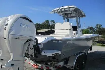 Slide: The Image of 2026 Sea Fox 282 Hybrid LT boat with dual engines on a trailer. - 3