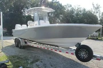 Slide: The Image of 2026 Sea Fox 282 Hybrid LT boat on trailer, parked outdoors. - 4