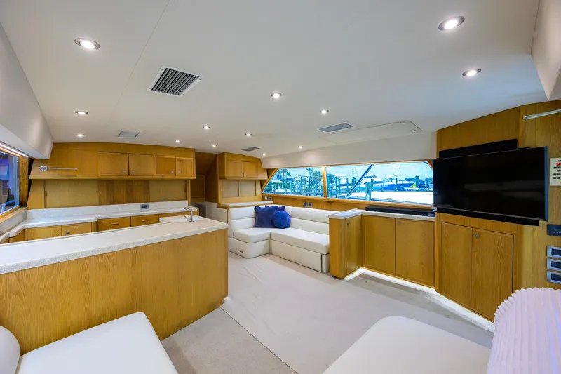 Slide: The Image of Luxurious interior of a 1998 Bertram 54 yacht with modern amenities and wooden cabinetry. - 15