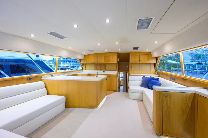 Slide: The Image of Luxurious interior of a 1998 Bertram 54 yacht with modern furnishings and ample natural light. - 7