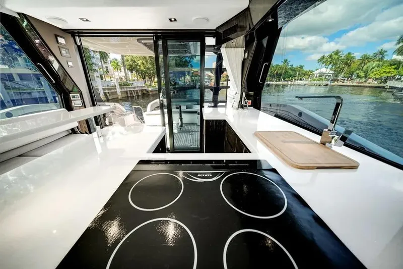 Slide: The Image of Modern kitchen interior on 2024 Galeon 500 Fly yacht with scenic water view. - 23