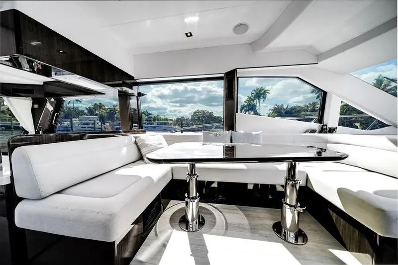 Slide: The Image of Luxurious interior of 2024 Galeon 500 Fly yacht with panoramic windows and elegant seating. - 29