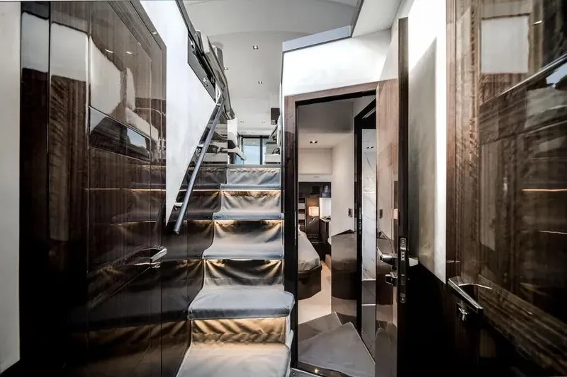 Slide: The Image of Luxurious interior of 2024 Galeon 500 Fly yacht with sleek staircase and modern design. - 39