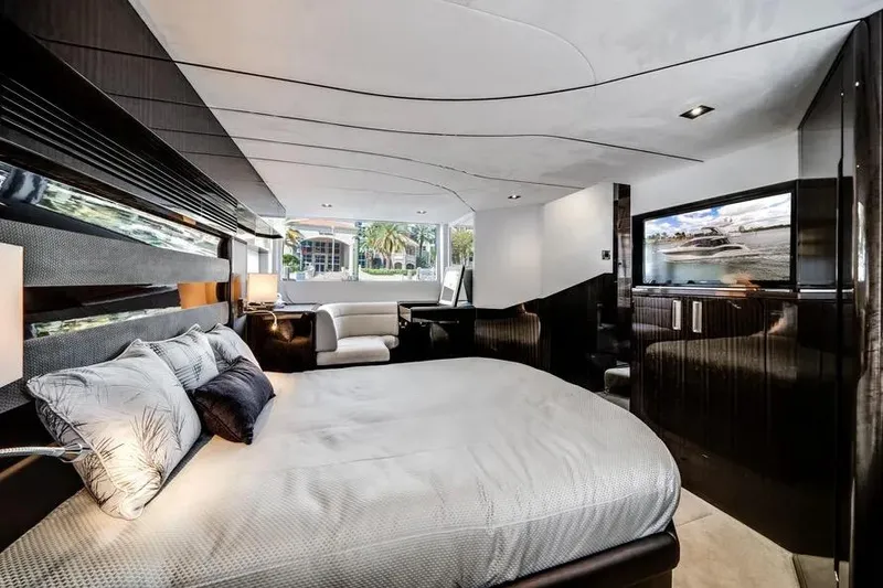Slide: The Image of Luxurious interior of 2024 Galeon 500 Fly yacht with elegant bedroom and scenic window view. - 40