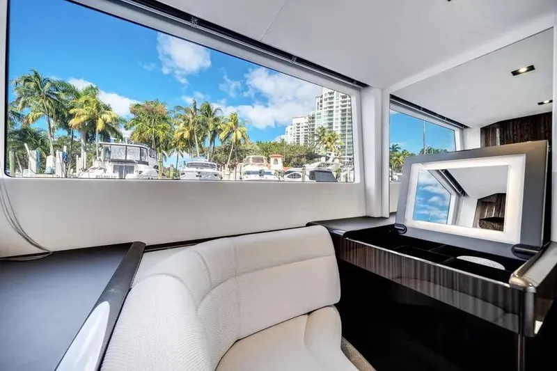 Slide: The Image of Interior view of 2024 Galeon 500 Fly yacht with marina and palm trees outside. - 45
