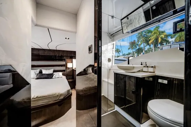 Slide: The Image of Luxurious interior of 2024 Galeon 500 Fly yacht featuring bedroom and modern bathroom. - 46