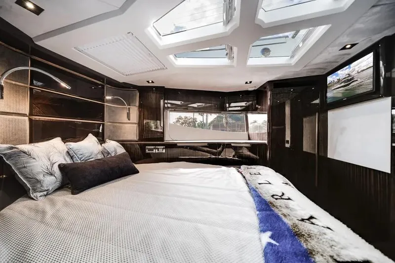 Slide: The Image of Luxurious bedroom interior of 2024 Galeon 500 Fly yacht with skylights and modern decor. - 49