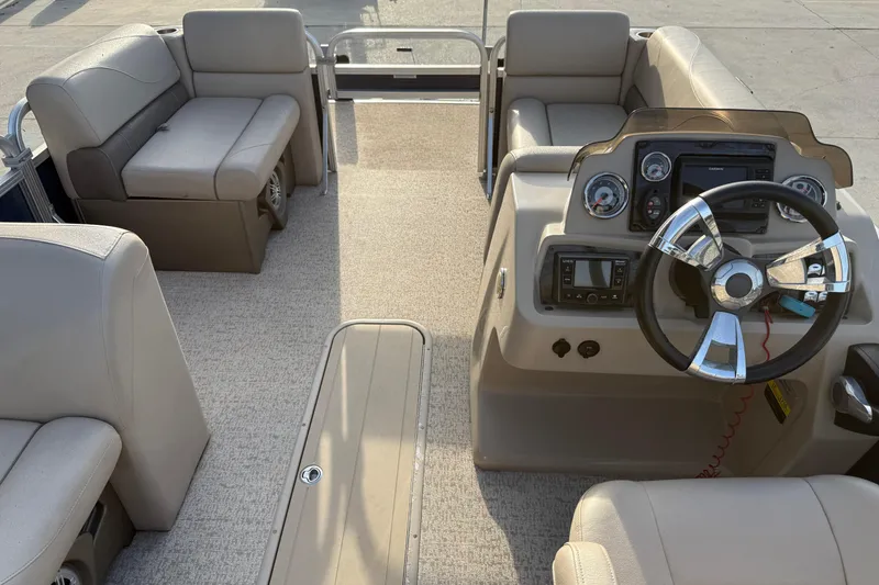 Slide: The Image of 2019 Avalon Venture Fish N Cruise boat interior with steering console and seating. - 11