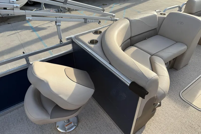 Slide: The Image of 2019 Avalon Venture Fish N Cruise boat interior with beige seating and cup holders. - 13