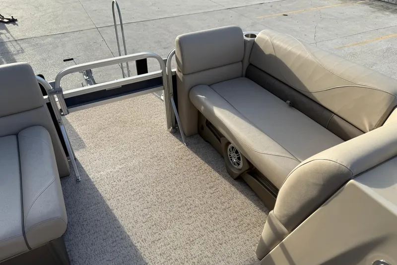 Slide: The Image of 2019 Avalon Venture Fish N Cruise 20' boat interior with beige seating and carpeted floor. - 15