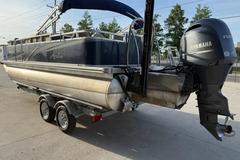 Slide: The Image of 2019 Avalon Venture Fish N Cruise 20' pontoon boat with Yamaha 150 engine on trailer. - 4