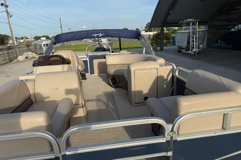 Slide: The Image of 2019 Avalon Venture Fish N Cruise 20' pontoon boat with beige seating and canopy. - 8