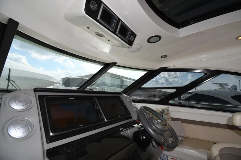 Slide: The Image of Interior cockpit of 2013 Sea Ray Sundancer 540 yacht with modern navigation equipment. - 11