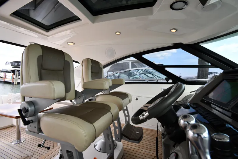 Slide: The Image of Interior of 2013 Sea Ray Sundancer 540 yacht with luxurious seating and modern helm. - 13