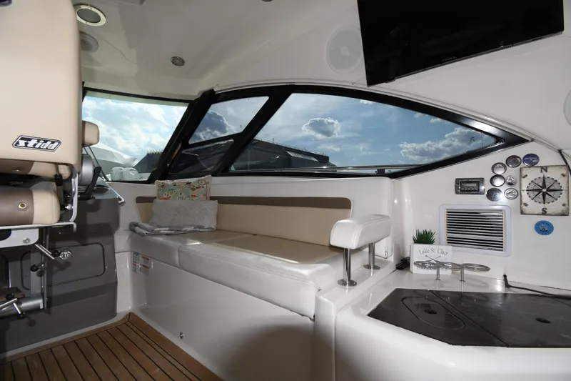 Slide: The Image of Interior of 2013 Sea Ray Sundancer 540 yacht with seating and navigation instruments. - 20