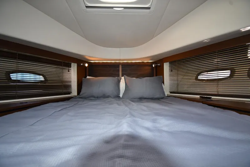 Slide: The Image of Luxurious bedroom interior of 2013 Sea Ray Sundancer 540 yacht with cozy bedding. - 27