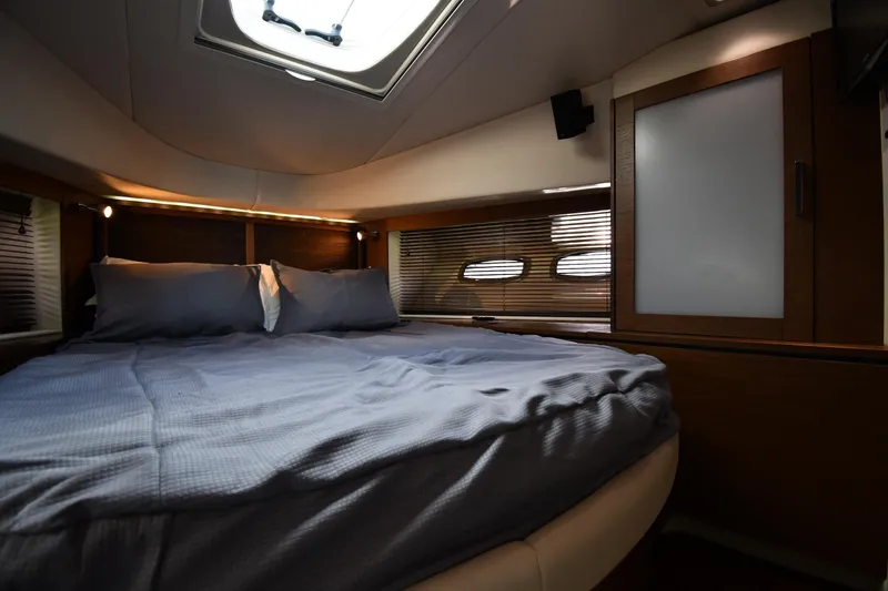 Slide: The Image of Luxurious cabin interior of 2013 Sea Ray Sundancer 540 yacht with cozy bedding. - 28