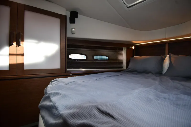 Slide: The Image of Luxurious cabin interior of 2013 Sea Ray Sundancer 540 yacht with cozy bedding. - 29