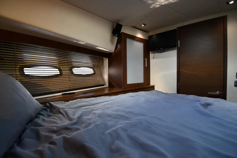 Slide: The Image of Luxurious cabin interior of 2013 Sea Ray Sundancer 540 yacht with cozy bedding. - 31