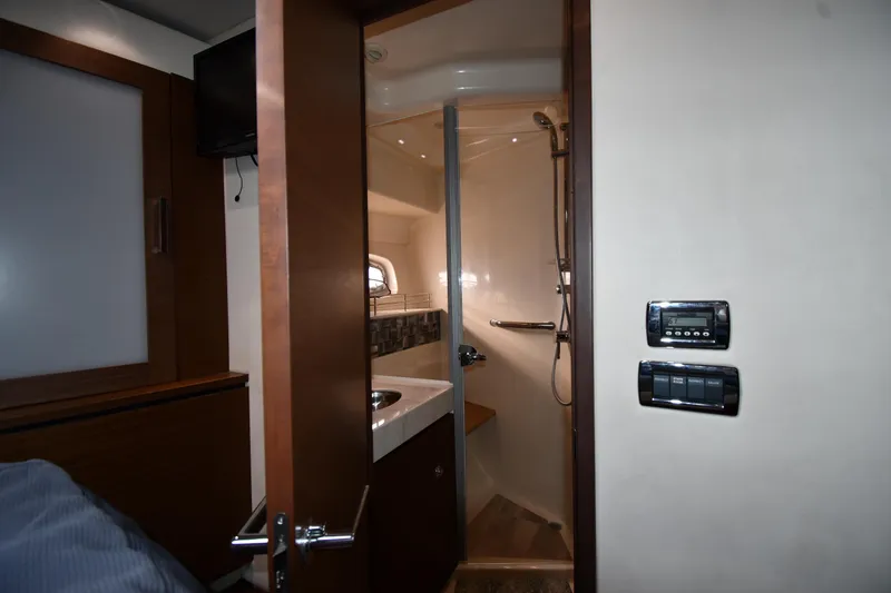 Slide: The Image of Interior of 2013 Sea Ray Sundancer 540 yacht featuring a compact bathroom. - 32