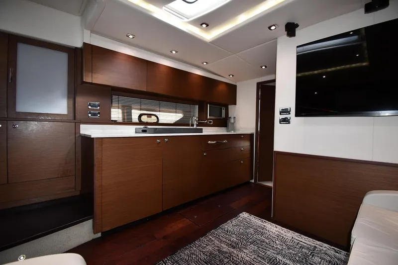 Slide: The Image of Luxurious interior of 2013 Sea Ray Sundancer 540 yacht with modern kitchen amenities. - 36