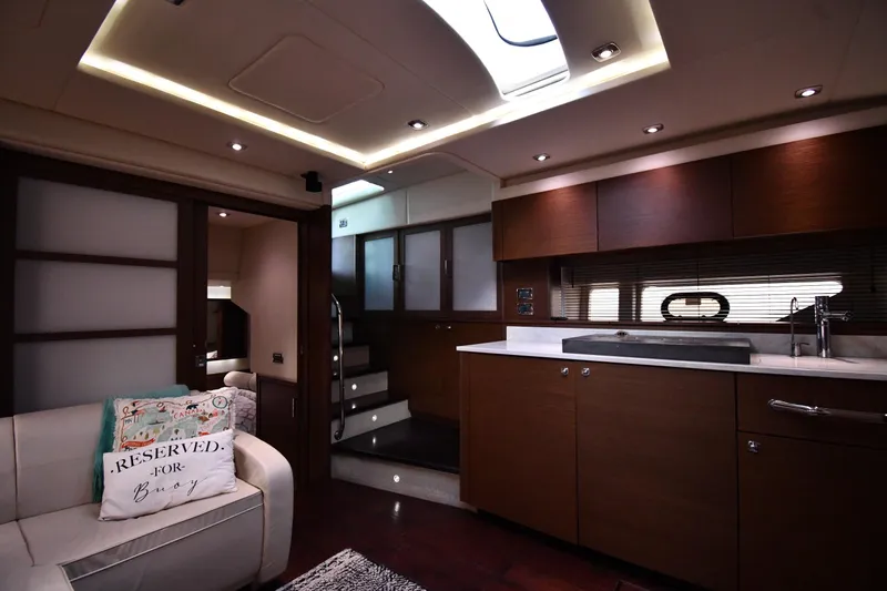 Slide: The Image of Luxurious interior of 2013 Sea Ray Sundancer 540 yacht with modern kitchen and cozy seating. - 37