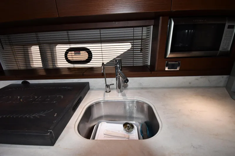 Slide: The Image of Modern kitchen area in 2013 Sea Ray Sundancer 540 yacht with sink and microwave. - 39