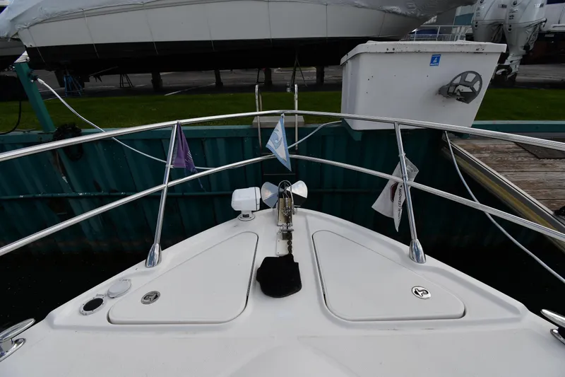 Slide: The Image of Bow view of 2013 Sea Ray Sundancer 540 yacht docked at marina. - 4
