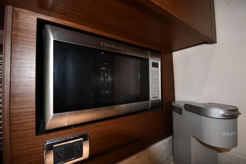Slide: The Image of Built-in microwave and coffee maker in 2013 Sea Ray Sundancer 540 yacht kitchen. - 40