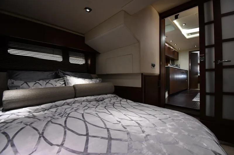 Slide: The Image of Luxurious interior of 2013 Sea Ray Sundancer 540 yacht, featuring a cozy bedroom and modern kitchen. - 45
