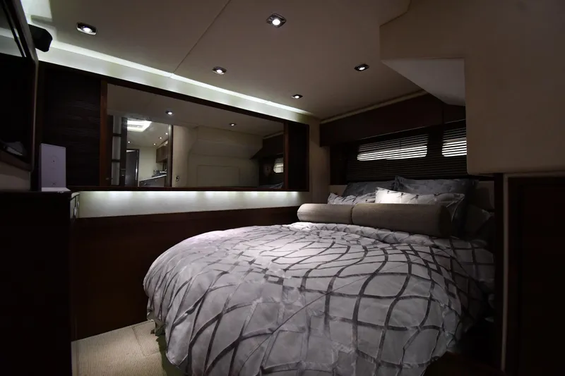 Slide: The Image of Luxurious bedroom interior of 2013 Sea Ray Sundancer 540 yacht with elegant bedding and ambient lighting. - 46
