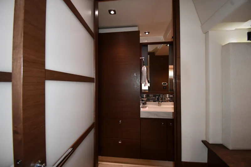 Slide: The Image of Interior of 2013 Sea Ray Sundancer 540 yacht, featuring a modern bathroom with wood accents. - 48