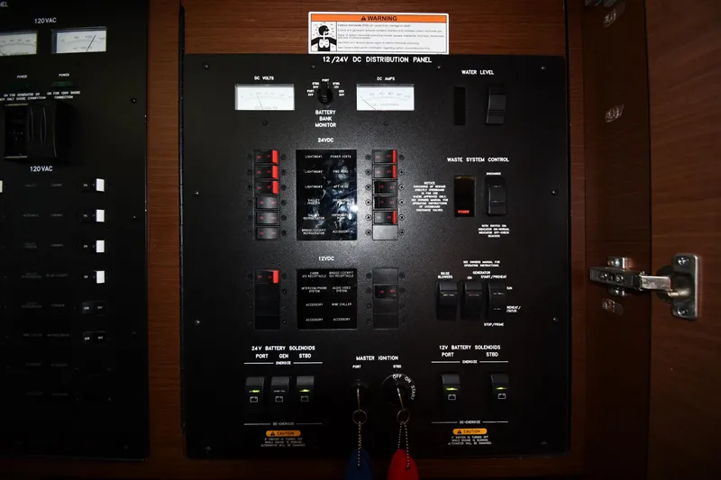 Slide: The Image of Control panel of a 2013 Sea Ray Sundancer 540 yacht, featuring various switches and gauges. - 52