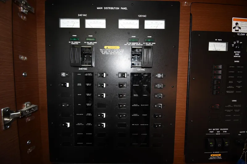 Slide: The Image of Electrical panel of a 2013 Sea Ray Sundancer 540 yacht, featuring 240VAC and 120VAC controls. - 53