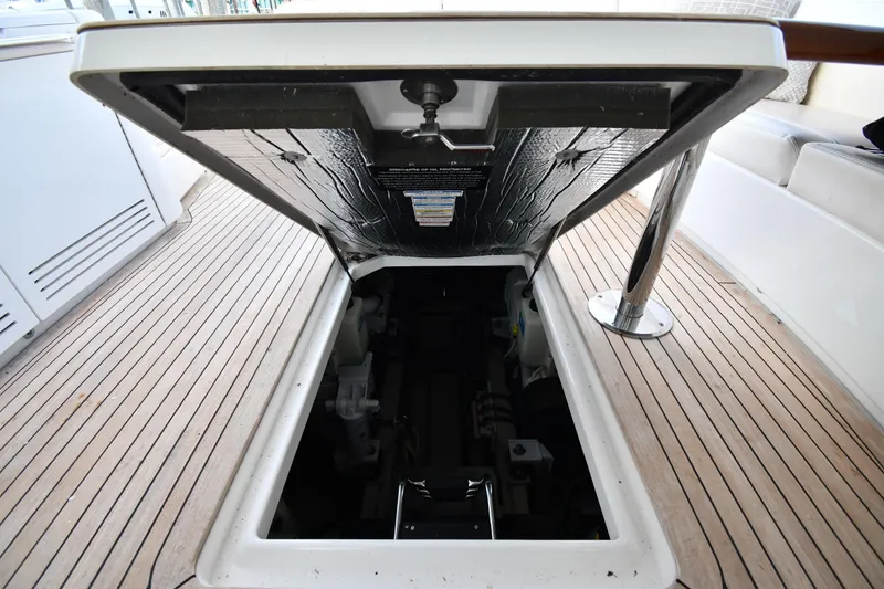 Slide: The Image of Open engine compartment on 2013 Sea Ray Sundancer 540 yacht with teak flooring. - 55