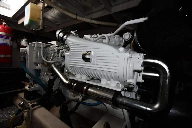 Slide: The Image of Engine room of 2013 Sea Ray Sundancer 540 yacht, showcasing detailed machinery components. - 56