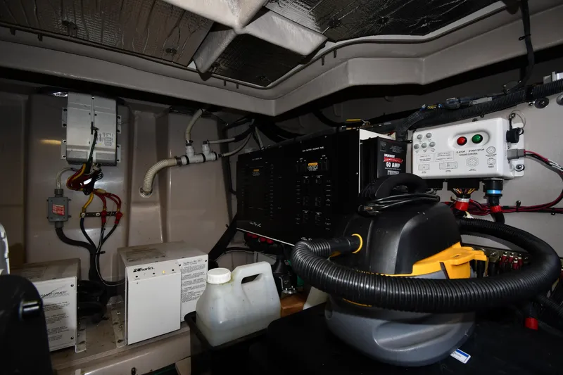 Slide: The Image of Engine room of 2013 Sea Ray Sundancer 540 with electrical components and equipment. - 59