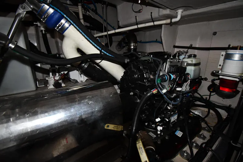 Slide: The Image of Engine room of 2013 Sea Ray Sundancer 540 yacht, showcasing mechanical components and wiring. - 61