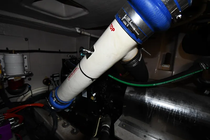 Slide: The Image of Engine room of 2013 Sea Ray Sundancer 540 with visible piping and components. - 62