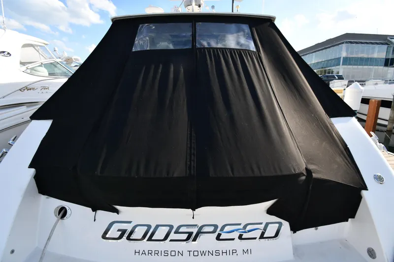 Slide: The Image of 2013 Sea Ray Sundancer 540 yacht with black cover, docked in Harrison Township, MI. - 63