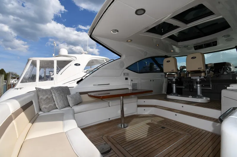 Slide: The Image of Luxurious 2013 Sea Ray Sundancer 540 yacht interior with seating and helm chairs. - 9
