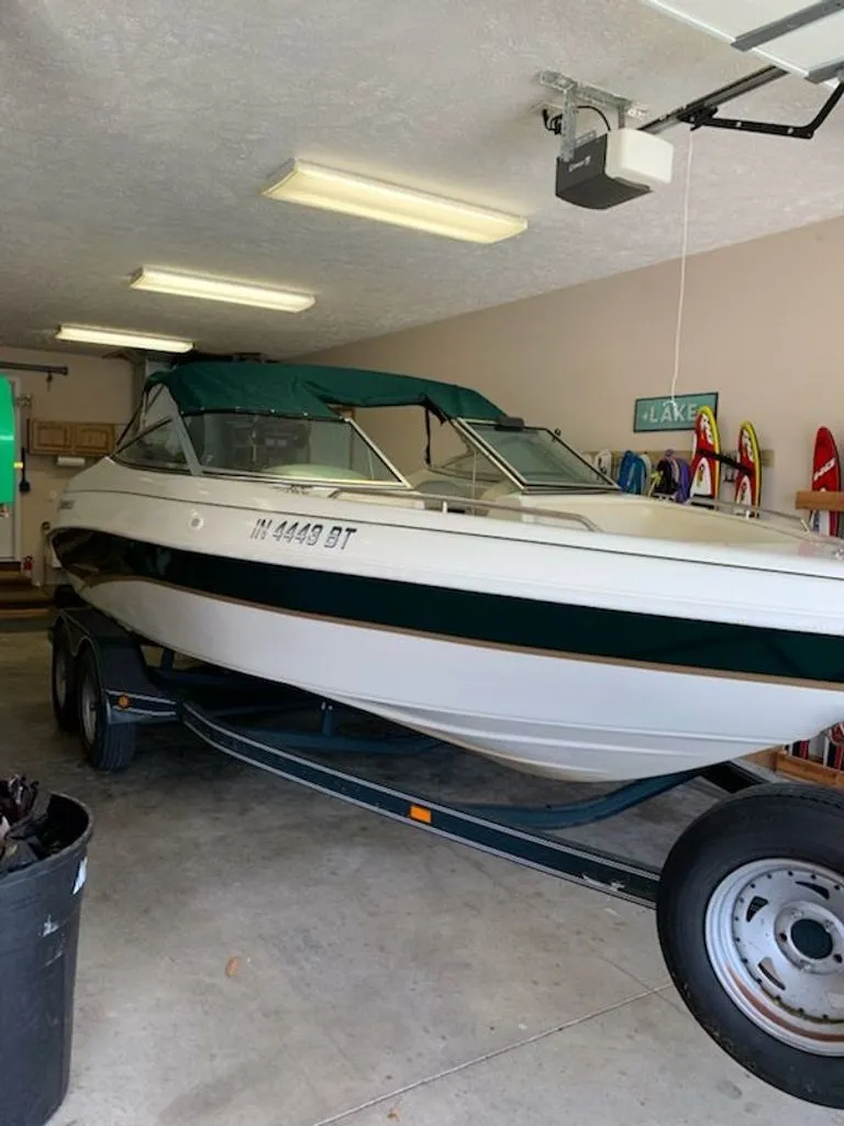 The Image of 2001 Caravelle Open Bow boat in garage on trailer. - 0
