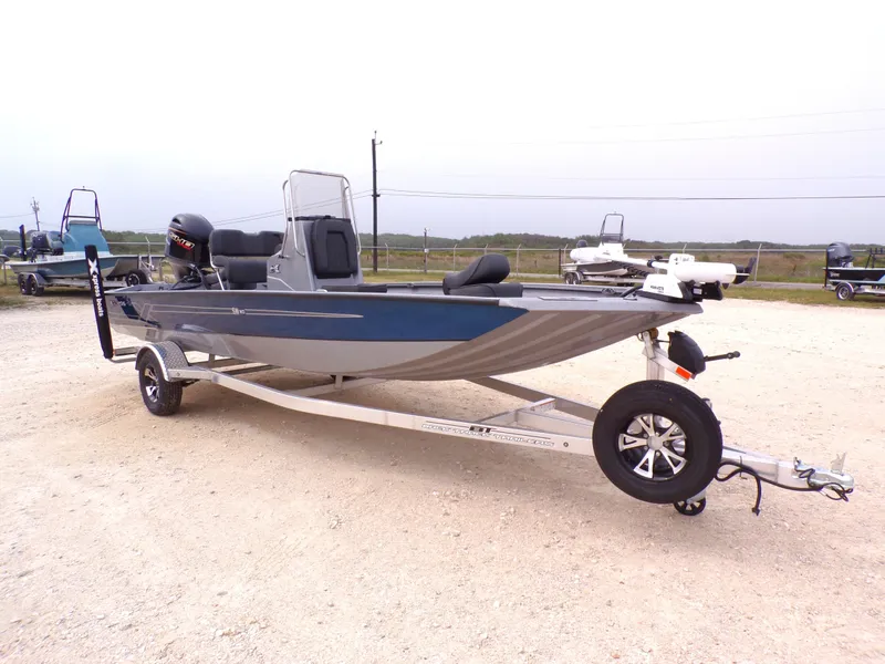 Slide: The Image of 2026 Xpress SW20B boat on trailer, side view. - 12