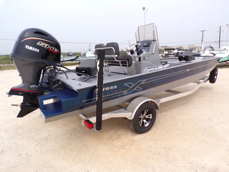 Slide: The Image of 2026 Xpress SW20B boat with Yamaha engine on trailer. - 14