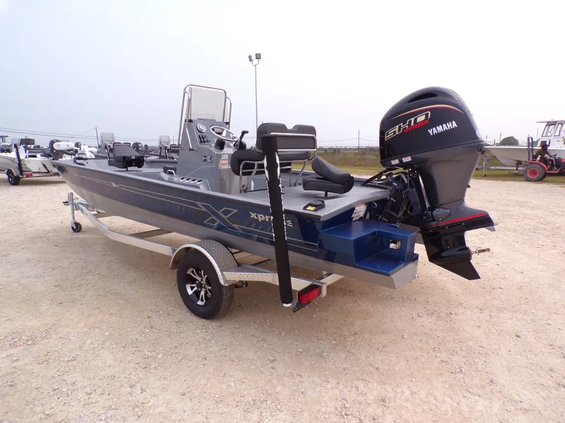 Slide: The Image of 2026 Xpress SW20B boat with Yamaha motor on trailer. - 17
