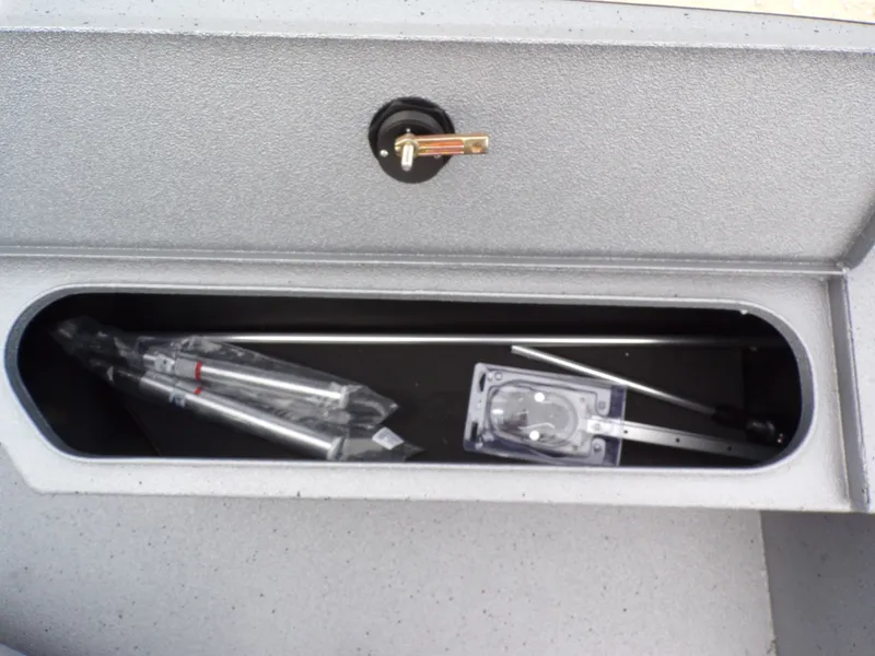 Slide: The Image of Xpress SW20B 2026 boat storage compartment with accessories. - 24