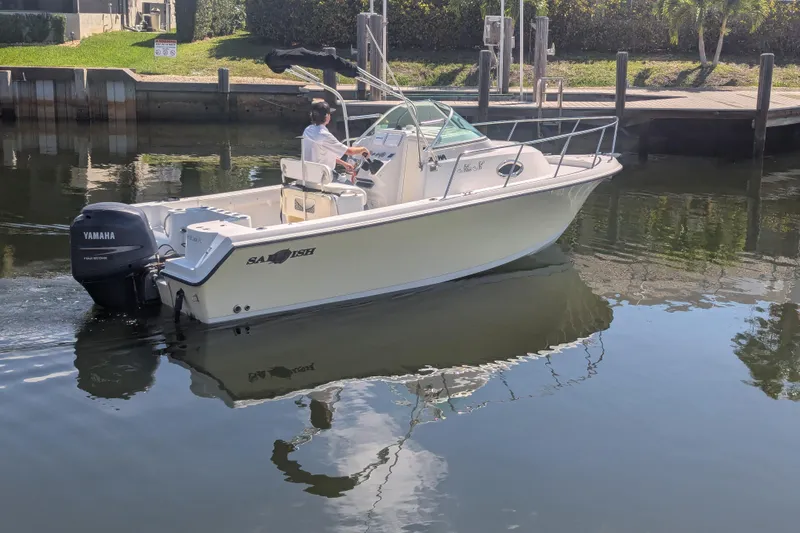Slide: The Image of 2005 Sailfish 218 WAC boat with Yamaha motor on calm water. - 4
